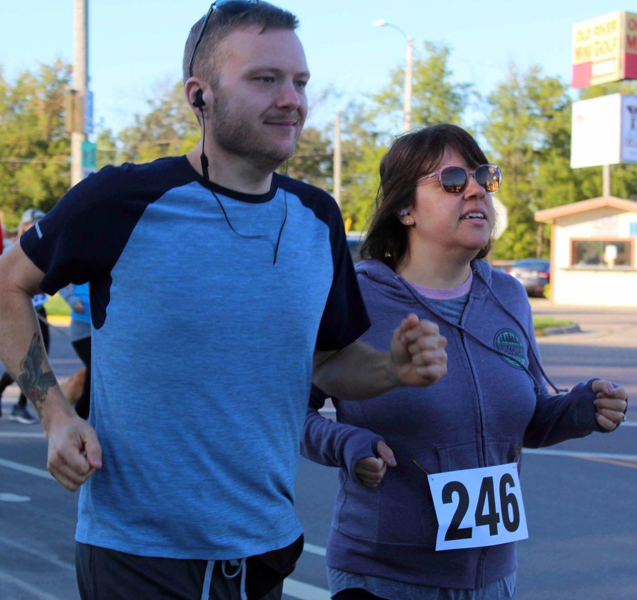 Runners race down La Crosse Street